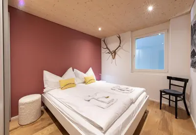 Ein Bett oder Betten in einem Zimmer der Unterkunft Chalet Am Acher