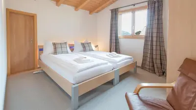 Ein Bett oder Betten in einem Zimmer der Unterkunft Chalet Millennium