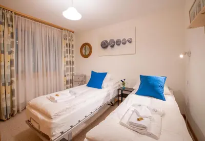 Ein Bett oder Betten in einem Zimmer der Unterkunft Chalet Panorama