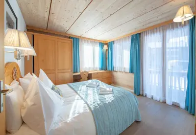 Ein Bett oder Betten in einem Zimmer der Unterkunft Chalet Stella Penthouse Residence