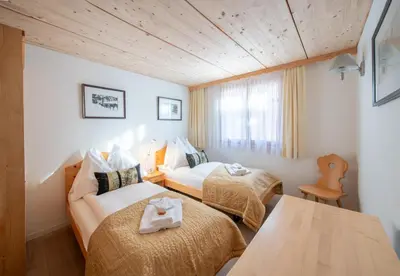 Ein Bett oder Betten in einem Zimmer der Unterkunft Chalet Stella Penthouse Residence