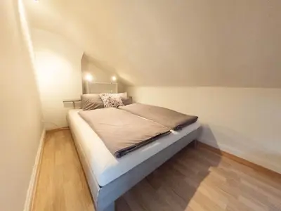 Ein Bett oder Betten in einem Zimmer der Unterkunft Ferienwohnung Meiringen 