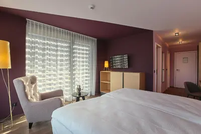 Ein Bett oder Betten in einem Zimmer der Unterkunft Links Leuk Golfresort