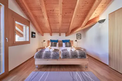 Ein Bett oder Betten in einem Zimmer der Unterkunft Chalet Bergfrieden Penthouse