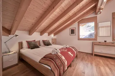 Ein Bett oder Betten in einem Zimmer der Unterkunft Chalet Bergfrieden Penthouse