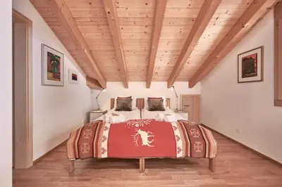 Ein Bett oder Betten in einem Zimmer der Unterkunft Chalet Bergfrieden Penthouse