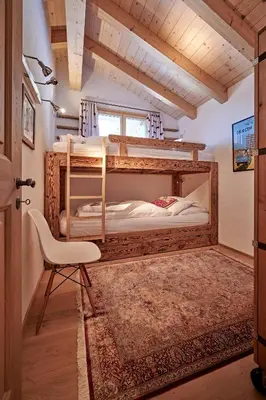 Ein Bett oder Betten in einem Zimmer der Unterkunft Chalet Bärgsunna Penthouse