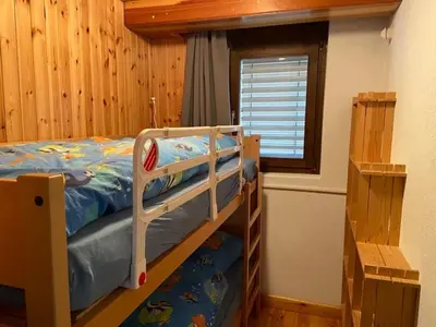 Ein Bett oder Betten in einem Zimmer der Unterkunft Ferienwohnung ViOs im Haus Castello