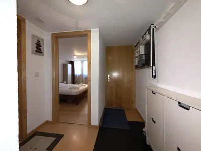 Ein Bett oder Betten in einem Zimmer der Unterkunft Chalet-Etage Mitten im Dorf