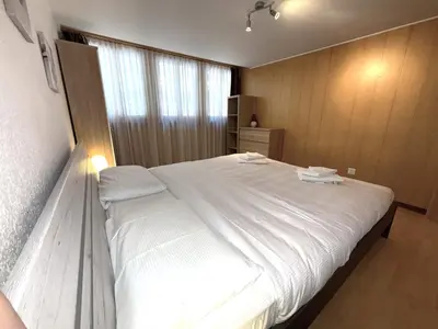 Ein Bett oder Betten in einem Zimmer der Unterkunft Chalet-Etage Mitten im Dorf