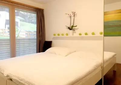 Ein Bett oder Betten in einem Zimmer der Unterkunft Apartment Superior Parrot