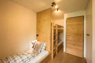 Ein Bett oder Betten in einem Zimmer der Unterkunft Chalet Sunneblick