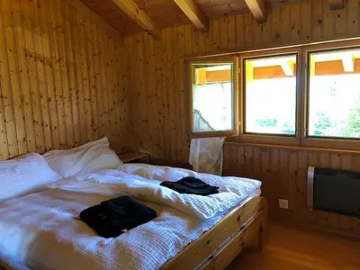 Ein Bett oder Betten in einem Zimmer der Unterkunft A l'orée du bisse