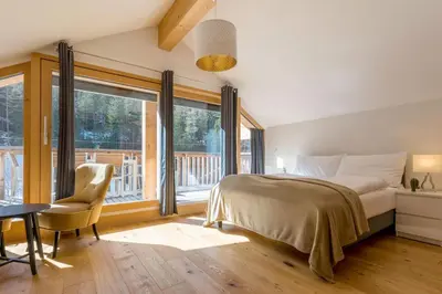 Ein Bett oder Betten in einem Zimmer der Unterkunft Montela Apartment-Hotel & Resort in the holiday region Saas-Fee Saastal