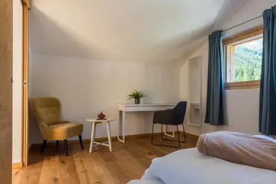 Ein Bett oder Betten in einem Zimmer der Unterkunft Montela Apartment-Hotel & Resort in the holiday region Saas-Fee Saastal