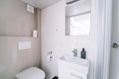 Ein Badezimmer in der Unterkunft Hotel Les Amis