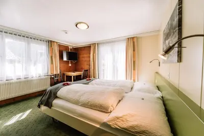 Ein Bett oder Betten in einem Zimmer der Unterkunft Hotel Les Amis
