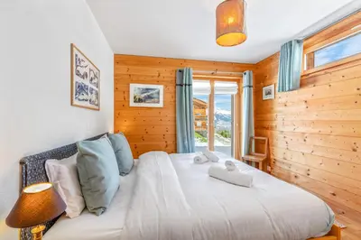 Ein Bett oder Betten in einem Zimmer der Unterkunft Chalet Magrappe, accès direct à la piste des Mayens de Veysonnaz