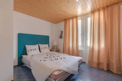 Ein Bett oder Betten in einem Zimmer der Unterkunft Swiss Mountains Apartments