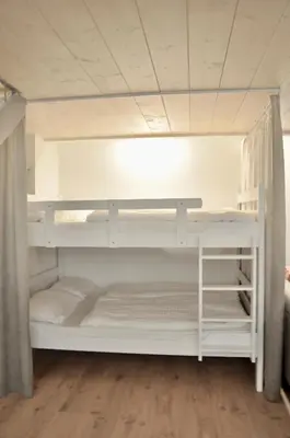 Ein Bett oder Betten in einem Zimmer der Unterkunft Modern Family Apartment in Interlaken Center