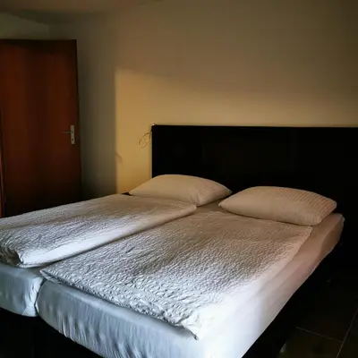 Ein Bett oder Betten in einem Zimmer der Unterkunft FeWo Fernsicht Crystal