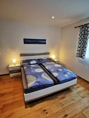 Ein Bett oder Betten in einem Zimmer der Unterkunft Brunnematta