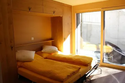 Ein Bett oder Betten in einem Zimmer der Unterkunft Studio Sunnublüäma