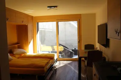 Ein Bett oder Betten in einem Zimmer der Unterkunft Studio Sunnublüäma
