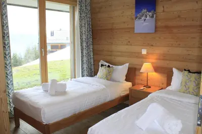 Ein Bett oder Betten in einem Zimmer der Unterkunft Chalet Wildhorn, à 2 pas de la piste de Veysonnaz