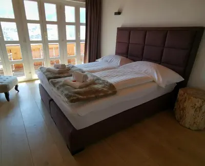 Ein Bett oder Betten in einem Zimmer der Unterkunft Chalet M