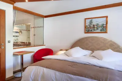 Ein Bett oder Betten in einem Zimmer der Unterkunft Hotel Beau Rivage