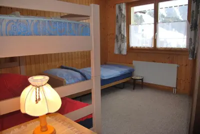 Ein Bett oder Betten in einem Zimmer der Unterkunft Ferienwohnung Bürchen