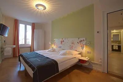Ein Bett oder Betten in einem Zimmer der Unterkunft Boutique Hotel Bellevue
