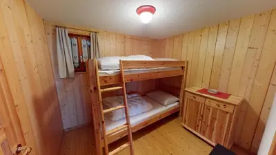 Ein Bett oder Betten in einem Zimmer der Unterkunft Am Färrichlift