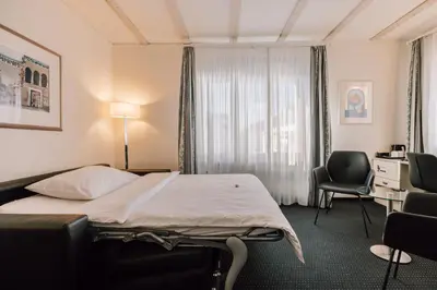 Ein Bett oder Betten in einem Zimmer der Unterkunft Stella Swiss Quality Hotel