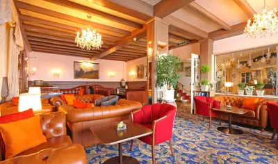 Ein Sitzbereich in der Unterkunft Eiger Mürren Swiss Quality Hotel