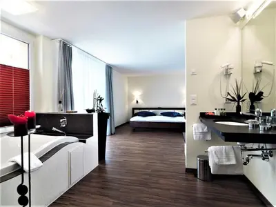 Ein Bett oder Betten in einem Zimmer der Unterkunft Wellnesshotel Schweizerhof