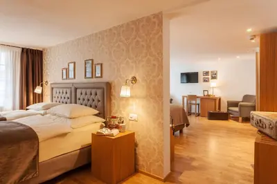 Ein Bett oder Betten in einem Zimmer der Unterkunft Hotel Walliserhof Zermatt