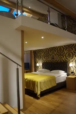Ein Bett oder Betten in einem Zimmer der Unterkunft Hotel Walliserhof Zermatt