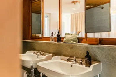 Ein Badezimmer in der Unterkunft Grand Hotel Belvedere, a Beaumier Hotel