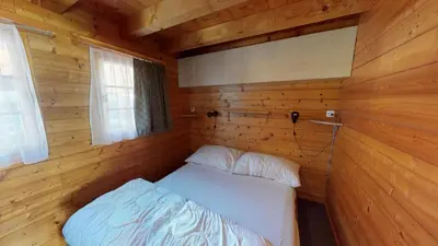 Ein Bett oder Betten in einem Zimmer der Unterkunft Residence Suisse RS1