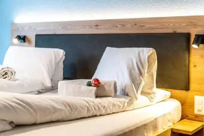 Ein Bett oder Betten in einem Zimmer der Unterkunft Hotel Kristall-Saphir Superior