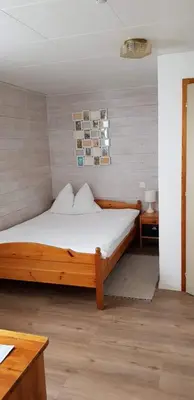 Ein Bett oder Betten in einem Zimmer der Unterkunft Gasthof Schoenegg B&B