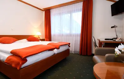 Ein Bett oder Betten in einem Zimmer der Unterkunft Hotel Elite
