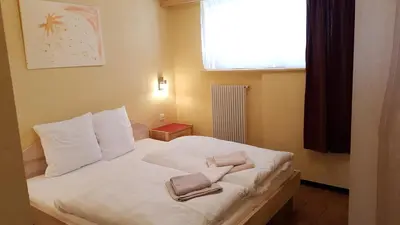Ein Bett oder Betten in einem Zimmer der Unterkunft Hotel Europa Guest House