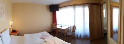 Ein Bett oder Betten in einem Zimmer der Unterkunft Hotel Europa Guest House