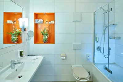 Ein Badezimmer in der Unterkunft Hotel Ambassador