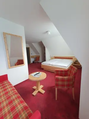 Ein Bett oder Betten in einem Zimmer der Unterkunft Hotel Strandhotel