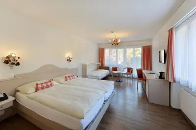 Ein Bett oder Betten in einem Zimmer der Unterkunft Hotel Beausite