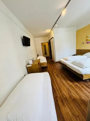 Ein Bett oder Betten in einem Zimmer der Unterkunft Hotel Toscana
